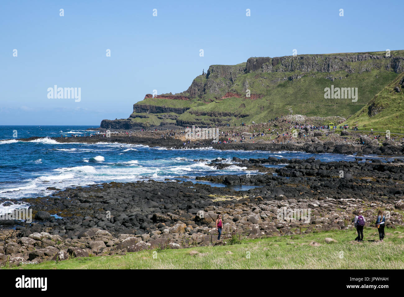 Giant`s Causeway coast with Port Reostan viewpoint called Finn`s Kitchen in the background in Bushmills Antrim Northern Ireland Stock Photo